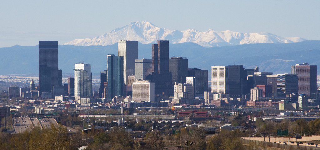 The Colorado State capitol dome in real Colorado gold gilding stands on the left in this skyline shot of downtown with the distant Pike's Peak mountain looming in the background in Denver on April 30, 2011.     UPI/Gary C. Caskey